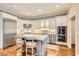 Modern kitchen with white cabinets, stainless steel appliances, and an island with barstool seating at 4503 Payton Oaks Ne Pl, Atlanta, GA 30345