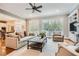 Cozy living room with a fireplace, hardwood floors, and access to outdoor views at 4503 Payton Oaks Ne Pl, Atlanta, GA 30345