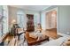 Elegant living room with hardwood floors, arched windows, and sophisticated decor creating a refined space at 4503 Payton Oaks Ne Pl, Atlanta, GA 30345