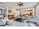 Open-concept living room featuring hardwood floors, neutral decor, and seamless transitions to other living areas at 4503 Payton Oaks Ne Pl, Atlanta, GA 30345