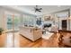 Bright living room featuring hardwood floors, a fireplace, and French doors leading to the yard at 4503 Payton Oaks Ne Pl, Atlanta, GA 30345