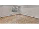 Neutral bedroom with a window and carpet at 4720 Buffalo St, Fairburn, GA 30213
