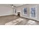 Bright and airy living room with a cozy fireplace and stylish flooring at 4720 Buffalo St, Fairburn, GA 30213
