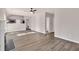 Open living space with fireplace and view of the kitchen at 4720 Buffalo St, Fairburn, GA 30213