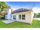 This house features a backyard with a lush green lawn and a cozy patio, perfect for relaxing outdoors at 4820 Camden Sw Dr, Conyers, GA 30094
