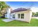 Home's backyard features manicured lawn, white siding, and patio area at 4820 Camden Sw Dr, Conyers, GA 30094