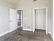 Neutral bedroom with carpeted floors and an open closet, creating a simple and functional space at 4820 Camden Sw Dr, Conyers, GA 30094