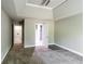 Bedroom features gray carpet, paint, and trim, with access to a bathroom and walk-in closet at 4820 Camden Sw Dr, Conyers, GA 30094