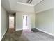 A neutral carpeted bedroom offers access to a bathroom and closet at 4820 Camden Sw Dr, Conyers, GA 30094