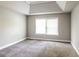 Bright bedroom with gray carpet and natural light from a large window at 4820 Camden Sw Dr, Conyers, GA 30094