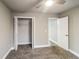 This is a bedroom with neutral walls and a ceiling fan, providing a calm and comfortable space at 4820 Camden Sw Dr, Conyers, GA 30094