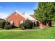 Charming brick home with a well-manicured lawn and mature trees at 4820 Camden Sw Dr, Conyers, GA 30094