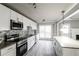 Modern kitchen with stainless steel appliances, granite counters, and stylish backsplash at 4820 Camden Sw Dr, Conyers, GA 30094