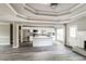 Bright, open-concept kitchen with island, white cabinets, granite countertops, and stainless steel appliances at 4820 Camden Sw Dr, Conyers, GA 30094