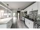 Spacious kitchen features an island, granite countertops, stainless steel appliances, and ample lighting at 4820 Camden Sw Dr, Conyers, GA 30094