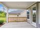The back porch features a wooden railing and grey door, providing a cozy outdoor space at 5133 Aster Bnd, Canton, GA 30114