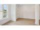 Bright interior space featuring hardwood flooring, large windows, and neutral paint at 5133 Aster Bnd, Canton, GA 30114