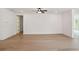Spacious living area featuring hardwood floors and neutral walls at 5133 Aster Bnd, Canton, GA 30114