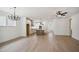 Open layout combining living, dining, and kitchen areas, with hardwood floors and neutral decor at 5133 Aster Bnd, Canton, GA 30114