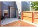Private back patio featuring a wood deck and concrete area, ideal for grilling and enjoying the outdoors at 5715 Keys Way, Lithonia, GA 30058