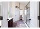 Bathroom featuring a large glass-enclosed shower, tiled floors, and neutral decor for a spa-like experience at 5715 Keys Way, Lithonia, GA 30058