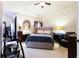Inviting bedroom with a comfortable bed, dark wood furnishings, and neutral decor creating a relaxing retreat at 5715 Keys Way, Lithonia, GA 30058