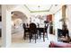 Bright dining room with green ceiling trim and an open view to the kitchen and living area at 5715 Keys Way, Lithonia, GA 30058