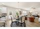 Open-concept living area connects kitchen, dining, and living rooms; natural light floods through the windows at 112 Maplewood Ln, Conyers, GA 30094