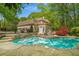 Stunning backyard with a pool, spa, and covered patio, perfect for relaxation at 302 Rolling Rock Se Rd, Marietta, GA 30067