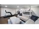 Finished basement offers a versatile space with fitness equipment and entertainment area at 302 Rolling Rock Se Rd, Marietta, GA 30067