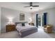 Bright bedroom with ample natural light, a ceiling fan and space for seating area at 302 Rolling Rock Se Rd, Marietta, GA 30067