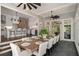 Open dining area featuring tile floors, access to the kitchen and views of the backyard at 302 Rolling Rock Se Rd, Marietta, GA 30067