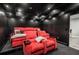 Enjoy movie nights in this private home theater room with plush seating and custom lighting at 302 Rolling Rock Se Rd, Marietta, GA 30067