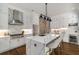 Bright modern kitchen featuring white cabinets, marble countertops, and stainless steel appliances at 302 Rolling Rock Se Rd, Marietta, GA 30067