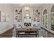 Cozy living room featuring built-in bookshelves, fireplace and natural lighting at 302 Rolling Rock Se Rd, Marietta, GA 30067