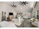 Open living room with a vaulted ceiling, wet bar, clerestory windows, and bright paint at 302 Rolling Rock Se Rd, Marietta, GA 30067