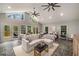 Bright living room with high ceilings, clerestory windows, fireplace, and access to a balcony at 302 Rolling Rock Se Rd, Marietta, GA 30067