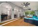 Expansive covered patio with ceiling fans, elegant seating, and access to the home's grand interior at 302 Rolling Rock Se Rd, Marietta, GA 30067