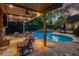 Inviting backyard pool with stone patio and ample seating area at 302 Rolling Rock Se Rd, Marietta, GA 30067