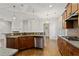 Open kitchen featuring granite countertops, stainless steel appliances, and a breakfast bar at 3241 Adams St, Atlanta, GA 30337