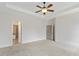 Bright main bedroom with carpet and view to the en-suite bathroom and closet at 3241 Adams St, Atlanta, GA 30337