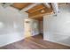 Spacious basement featuring wood-look flooring, painted walls, and open doorway leading to additional space at 5254 Greenpoint Dr, Stone Mountain, GA 30088