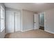 Carpeted bedroom has closet doors and access to a hallway and bathroom at 5254 Greenpoint Dr, Stone Mountain, GA 30088