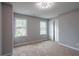 Carpeted bedroom with two windows and closet at 5254 Greenpoint Dr, Stone Mountain, GA 30088