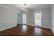 Dining room featuring hardwood floors, modern lighting, and neutral paint at 5254 Greenpoint Dr, Stone Mountain, GA 30088
