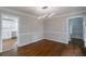 Dining room view showcasing the hardwood floors, neutral paint, and access to the kitchen at 5254 Greenpoint Dr, Stone Mountain, GA 30088