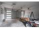 Spacious two-car garage with white walls, clear windows, and overhead door openers at 5254 Greenpoint Dr, Stone Mountain, GA 30088