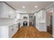 Spacious updated kitchen with stainless steel appliances and white cabinets at 5254 Greenpoint Dr, Stone Mountain, GA 30088