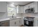 Kitchen with stainless steel appliances, and bright window at 5254 Greenpoint Dr, Stone Mountain, GA 30088
