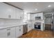 Updated kitchen featuring stainless steel appliances and white cabinetry at 5254 Greenpoint Dr, Stone Mountain, GA 30088